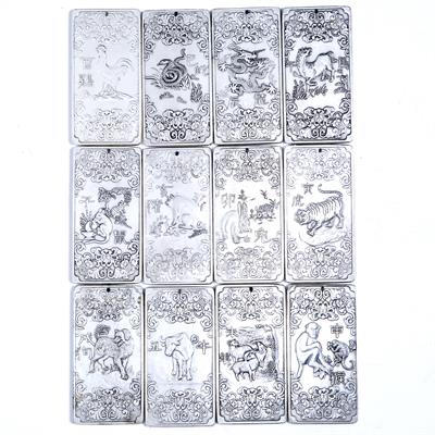 Lot 523 - Set of twelve white metal ingots/pendants