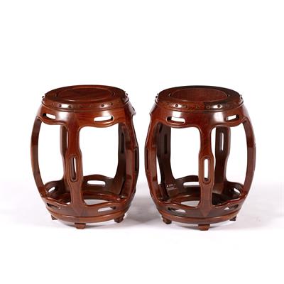 Lot 553 - Pair of hardwood barrel shaped stools