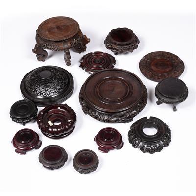 Lot 557 - Collection of hardwood stands and lids