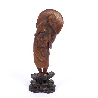 Lot 570 - Horn carving of a fisherman