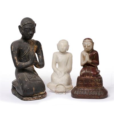 Lot 842 - Three kneeling models of monks