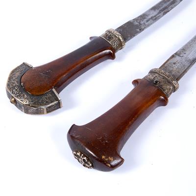 Lot 880 - Two white metal mounted jambiya with rhinoceros horn hilt