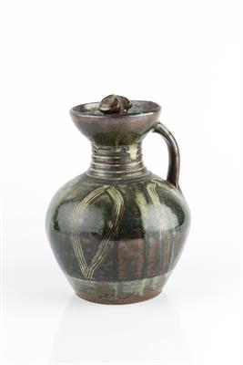 Lot 46 - Michael Cardew (1901-1983) at Abuja Pottery
Ewer
the tenmoku glaze with combed decoration
23cm high