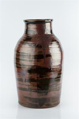 Lot 182 - Leach School
Large vase
iron red running glaze
impressed potter's seal covered in glaze
46cm high