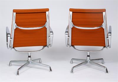 Lot 265 - Charles Eames (1907-1978) for Vitra 
A pair of EA 108 swivel chairs
aluminium base and orange...