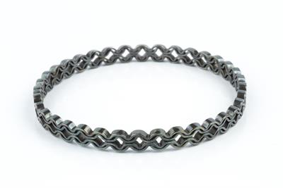 Lot 360M - Jack Spencer
Oxidised silver bangle
abstract twist design
with shield-shaped maker's...