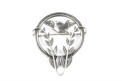 Lot 364M - Arno Malinowski (1899 - 1976) for Georg Jensen
Silver brooch
openwork circlet enclosing a bird...