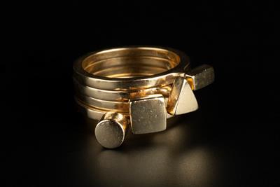 Lot 384 - Wendy Ramshaw (1939 - 2018)
Four 9ct gold stacking rings
applied with geometric panels
signed