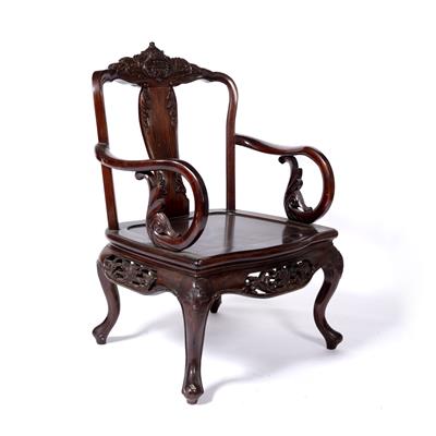 Lot 23 - Hardwood carved armchair
