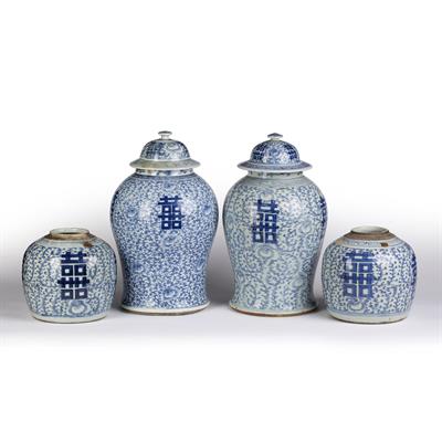 Lot 356 - Two similar blue and white baluster lidded vases