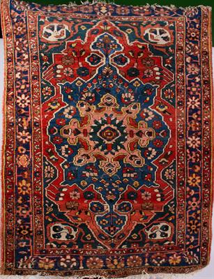 Lot 148 - AN OLD BLUE GROUND ORIENTAL RUG
