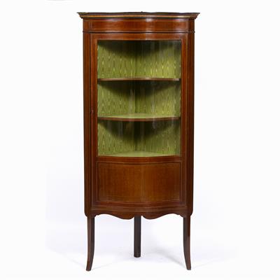 Lot 225 - AN EDWARDIAN MAHOGANY SERPENTINE FRONTED CORNER FLOOR STANDING DISPLAY CABINET