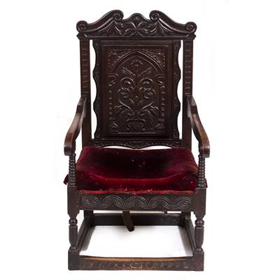 Lot 284 - AN ANTIQUE CARVED OAK WAINSCOT CHAIR