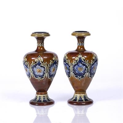 Lot 7 - A PAIR OF DOULTON LAMBETH BALUSTER VASES each decorated with a band of flower heads and scrolls