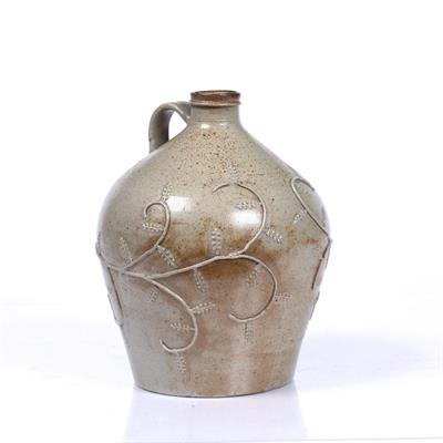 Lot 47 - A SALT GLAZED STONEWARE FLAGON relief decorated with trailing scroll oak leaf and branch decoration