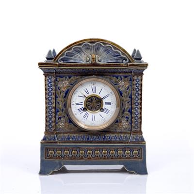 Lot 62 - A LATE 19TH CENTURY DOULTON LAMBETH CASED MANTEL CLOCK the convex white enamel dial with blue Roman