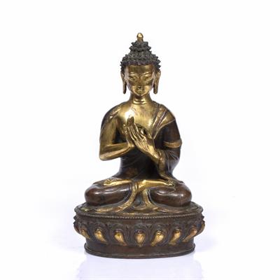 Lot 112 - A NEPALESE GILT AND PATINATED BRONZE BUDDHA with original seal mark to base