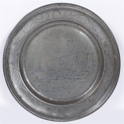 Lot 120 - AN 18TH CENTURY PEWTER WRIGGLEWORK CHARGER decorated with fishermen on the banks of a river