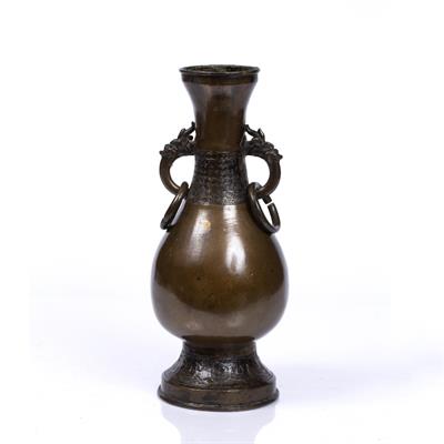 Lot 129 - A CHINESE BRONZE ALTAR VASE of baluster form with dragon ring handles