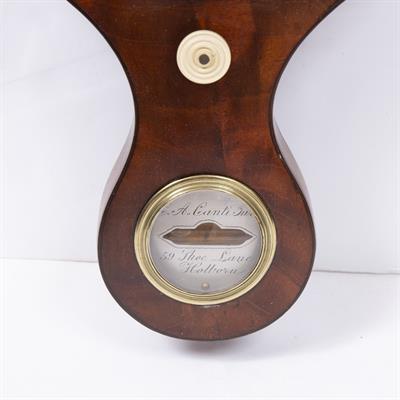 Lot 136 - A 19TH CENTURY BANJO WHEEL BAROMETER with swan neck cornice above hygrometer