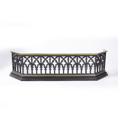 Lot 157 - A LATE VICTORIAN CAST IRON AND BRASS FENDER