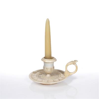 Lot 166 - A LATE 18TH/EARLY 19TH CENTURY IVORY CHAMBER CANDLESTICK of diminutive size carved in relief with