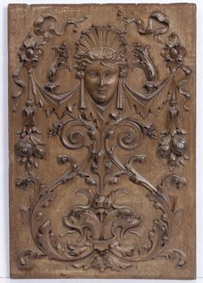 Lot 167 - A 19TH CENTURY WALNUT PANEL carved in renaissance style with mask head
