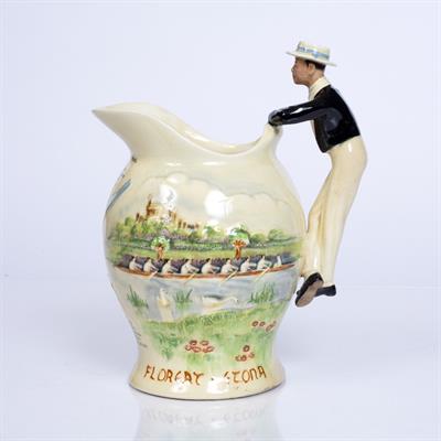 Lot 174 - A CROWN DEVON FIELDINGS MUSICAL JUG moulded in colours with Eton College and Rowing Team