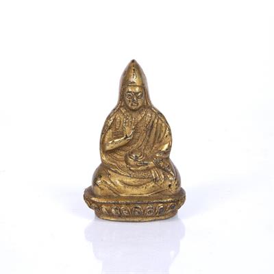 Lot 196 - A TIBETAN GILT BRONZE BUDDHA
