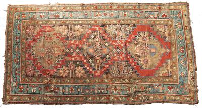 Lot 202 - A CAUCASIAN RUG with triple medallion filled with florettes