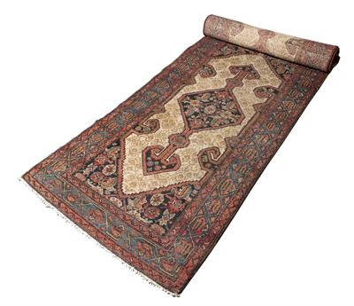 Lot 209 - AN OLD PERSIAN HAMADAN LONG RUNNER with an interlocking hooked diamond pattern on a camel ground