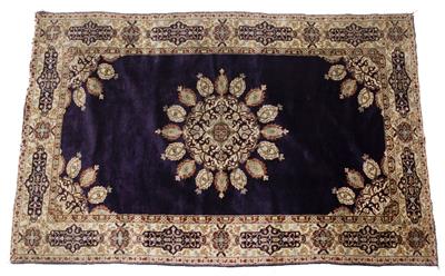 Lot 212 - A KASHMIRI PURPLE GROUND RUG with central lotus bud medallion within a multiple polychrome border