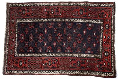 Lot 214 - AN OLD BELOUCH RUG with central star motif on a blue ground and within a hooked border