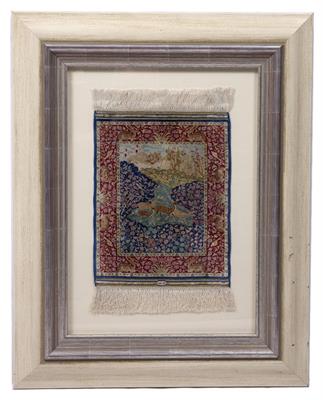 Lot 218 - A PERSIAN MINIATURE SILK RUG woven with deer in a landscape pattern in colours within a red border
