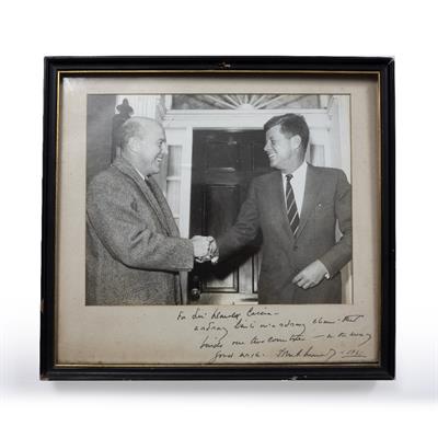 Lot 921 - A UNITED PRESS PHOTOGRAPH labelled verso 'President-Elect John F. Kennedy bids farewell to British