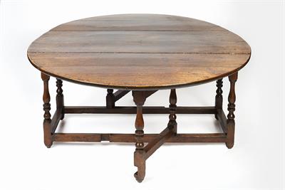Lot 21 - Large oak gate-leg dining table