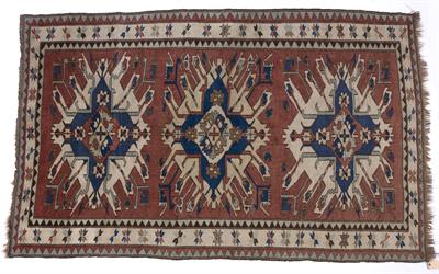 Lot 115 - Star Kazak style red ground rug