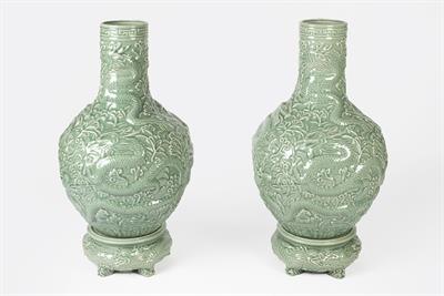 Lot 311 - Pair of green ground floor standing bottle vases