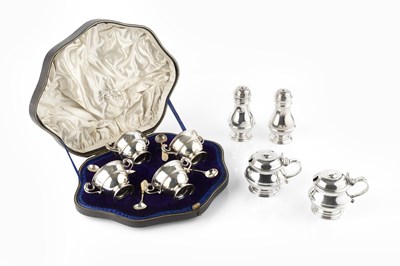 Lot 593 - A silver four piece cruet set, comprising a...