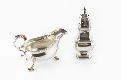 Lot 594 - A George V silver sauce boat, with gadrooned...