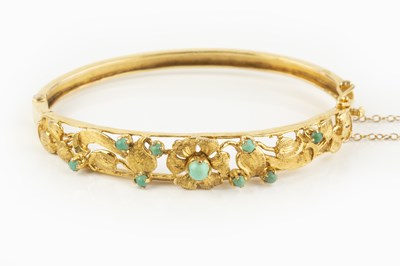 Lot 139 - A turquoise set bangle, of hinged oval form,...