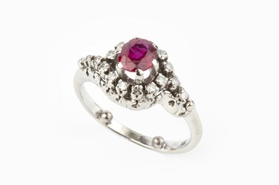 Lot 155 - A ruby and diamond cluster ring, of crossover...