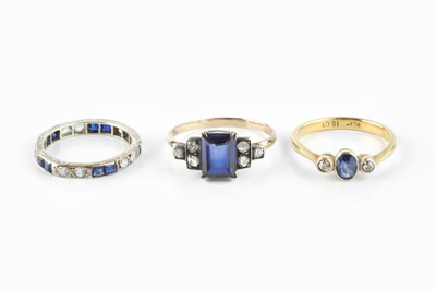 Lot 151 - A sapphire and diamond three stone ring, the...