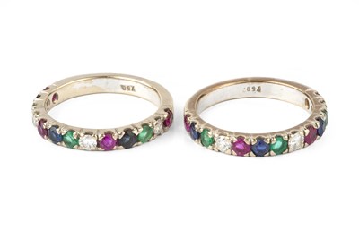 Lot 117 - A pair of diamond and vari gem-set half hoop...