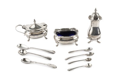 Lot 404 - A silver three piece cruet set, by Walker &...