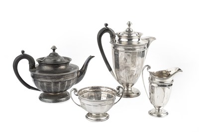 Lot 419 - A George V silver four piece tea service,...