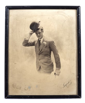 Lot 488 - A framed black and white photograph of a young...