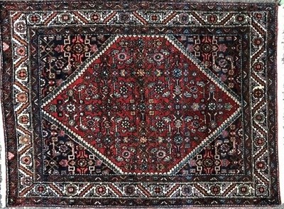 Lot 1042 - A 1920's red ground Hamadan rug