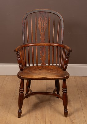 Lot 374 - A 19th century ash, elm and yew wood Windsor armchair