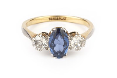 Lot 132 - A sapphire and diamond three stone ring, the...